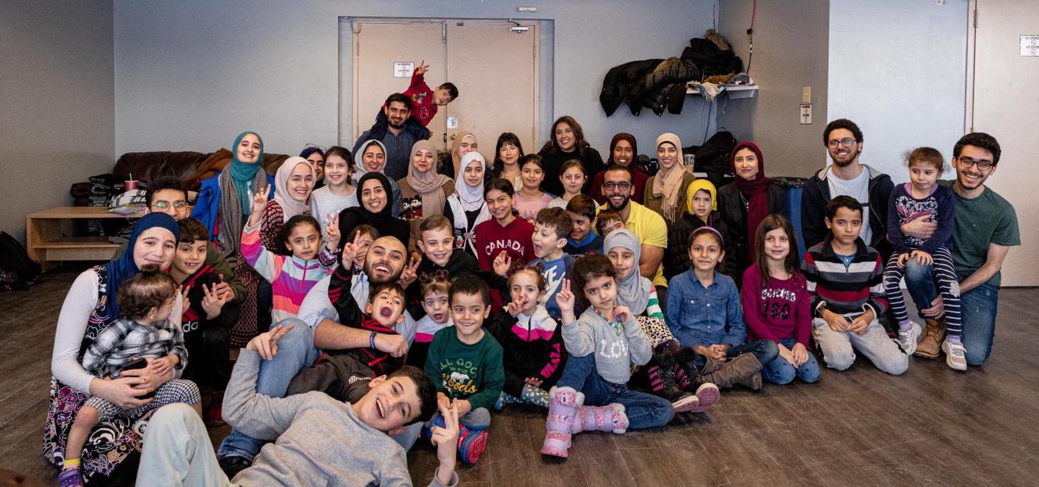 Group of mentors and kids posing for a photo